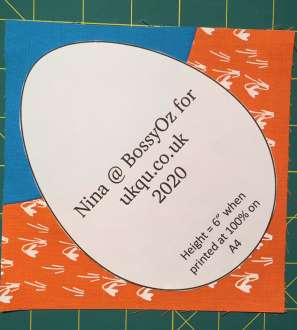 Showing the placement of the template on an orphan quilt block