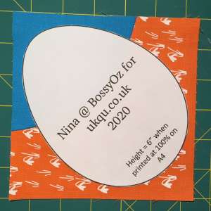 Showing the placement of the template on an orphan quilt block